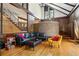 Great room with hardwood floors, second-story balcony, and spiral staircase at 1605 Saint Tropez Way, Atlanta, GA 30350