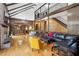 Spacious living room with a fireplace, second-story balcony, and hardwood floors at 1605 Saint Tropez Way, Atlanta, GA 30350