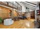 Expansive great room features wood paneling, wrought iron railing, and hardwood floors at 1605 Saint Tropez Way, Atlanta, GA 30350