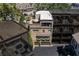 Aerial view of a townhome featuring a private rooftop deck and two-car garage at 3631 Habersham Nw Rd, Atlanta, GA 30305