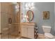 Bathroom featuring glass enclosed shower, granite topped vanity and white commode at 3631 Habersham Nw Rd, Atlanta, GA 30305