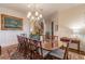Formal dining room featuring a chandelier, large painting, and ample seating for guests at 3631 Habersham Nw Rd, Atlanta, GA 30305
