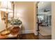 Hallway with hardwood floors leading to a bedroom with a four-poster bed at 3631 Habersham Nw Rd, Atlanta, GA 30305