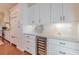 Bright kitchen features custom white cabinetry, marble countertops, and stainless steel wine cooler at 3631 Habersham Nw Rd, Atlanta, GA 30305