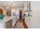 Bright kitchen with stainless steel appliances, white cabinetry, and pantry at 3631 Habersham Nw Rd, Atlanta, GA 30305