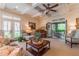 Relaxing living room features a piano, ample seating, and access to an outdoor patio at 3631 Habersham Nw Rd, Atlanta, GA 30305