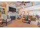 Open-concept living room with fireplace, built-ins, and seamless flow to kitchen and dining areas at 3631 Habersham Nw Rd, Atlanta, GA 30305