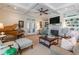 Inviting living room features coffered ceiling, fireplace, built-in shelving, and comfortable seating at 3631 Habersham Nw Rd, Atlanta, GA 30305