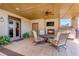 Outdoor patio featuring a fireplace, grill, ceiling fan and ample seating at 3631 Habersham Nw Rd, Atlanta, GA 30305
