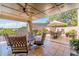 Spacious patio with wrought iron furniture, tile floors and an umbrella covered table at 3631 Habersham Nw Rd, Atlanta, GA 30305