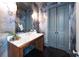 Elegant powder room with custom wallpaper, wood accents and marble countertop at 3630 Peachtree Ne Rd # 3401, Atlanta, GA 30326