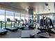 Modern gym featuring treadmills, bikes, weights, and floor-to-ceiling windows providing ample natural light at 3630 Peachtree Ne Rd # 3401, Atlanta, GA 30326