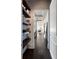 Bright hallway features hardwood floors and decorative floating shelving for storage and display at 3630 Peachtree Ne Rd # 3401, Atlanta, GA 30326