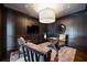 Sophisticated home office features dark wood paneling, designer lighting, and ample seating at 3630 Peachtree Ne Rd # 3401, Atlanta, GA 30326