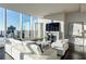 Well-lit living area with large windows and cozy fireplace at 3630 Peachtree Ne Rd # 3401, Atlanta, GA 30326