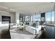 Open-concept living room featuring floor-to-ceiling windows and city views at 3630 Peachtree Ne Rd # 3401, Atlanta, GA 30326