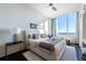 Bright bedroom featuring a large window, and luxury bedding at 3630 Peachtree Ne Rd # 3401, Atlanta, GA 30326