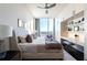 Bright bedroom featuring a ceiling fan, large window, and adjacent study nook at 3630 Peachtree Ne Rd # 3401, Atlanta, GA 30326