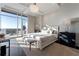 Bright main bedroom with cityscape view and a sliding glass door that leads to a balcony at 3630 Peachtree Ne Rd # 3401, Atlanta, GA 30326