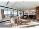 Spacious meeting room featuring multiple seating areas, a large window view, and contemporary lighting at 3630 Peachtree Ne Rd # 3401, Atlanta, GA 30326