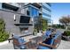 Outdoor lounge featuring a fireplace, comfortable seating, a TV, and views of the surrounding landscape at 3630 Peachtree Ne Rd # 3401, Atlanta, GA 30326