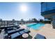 Rooftop pool with stunning city views, lounge chairs, and clear blue water for a luxurious experience at 3630 Peachtree Ne Rd # 3401, Atlanta, GA 30326