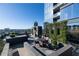 Stylish rooftop terrace with outdoor seating, planters, city views, and a built-in grill at 3630 Peachtree Ne Rd # 3401, Atlanta, GA 30326