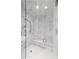 Modern walk-in shower with marble tile and a built-in bench at 3630 Peachtree Ne Rd # 3401, Atlanta, GA 30326