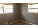 Cozy bedroom featuring two large windows that provide natural light and carpeted flooring at 5250 Hollyhock Rd, Douglasville, GA 30135