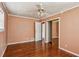 Bedroom featuring hardwood floors, closet, and open doorway at 1310 Loch Lomond Sw Trl, Atlanta, GA 30331