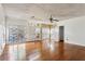 Living room with hardwood floors and natural light through large windows at 1310 Loch Lomond Sw Trl, Atlanta, GA 30331