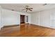 Bright living room with hardwood floors and french doors to the dining area at 1310 Loch Lomond Sw Trl, Atlanta, GA 30331