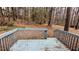 Exterior view of a weathered wood deck in a wooded backyard at 3515 Weathered Wood Dr, Ellenwood, GA 30294