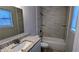 Bathroom featuring a tub-shower combo with tiled surround, and modern vanity at 3515 Weathered Wood Dr, Ellenwood, GA 30294