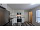 Modern kitchen features white cabinets, stainless steel appliances, granite countertops, and subway tile backsplash at 3515 Weathered Wood Dr, Ellenwood, GA 30294
