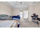 Spacious bedroom featuring carpeting and large window providing lots of natural light at 5806 Highgrove Dr, Atlanta, GA 30349