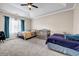 Bedroom featuring a ceiling fan, a crib and bright natural light at 5806 Highgrove Dr, Atlanta, GA 30349