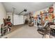 View of organized garage with tools, shelving, storage and a white garage door at 5806 Highgrove Dr, Atlanta, GA 30349