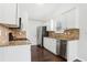 Kitchen featuring white cabinets, stainless steel appliances, granite countertops, and tile backsplash at 642 Jenmarie Sw Dr, Mableton, GA 30126