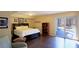 Basement bedroom with luxury vinyl floors, and sliding glass doors to the outdoors at 1104 Fox Ln, Woodstock, GA 30188