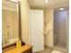 Bathroom featuring a vanity with a large mirror and a glass shower at 1104 Fox Ln, Woodstock, GA 30188