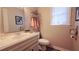 Bathroom featuring a white vanity, toilet, and decorative shelving at 1104 Fox Ln, Woodstock, GA 30188