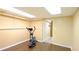 Finished exercise room with neutral walls and a new elliptical machine at 1104 Fox Ln, Woodstock, GA 30188