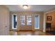 Inviting foyer features hardwood floors, a double-door entry, and sidelight windows for natural light at 1104 Fox Ln, Woodstock, GA 30188