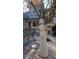 Charming front yard featuring decorative sculpture, complemented by a bench and the house number clearly visible above the door at 1104 Fox Ln, Woodstock, GA 30188