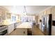 Bright kitchen with stone countertops, stainless appliances, a large island, and an open layout at 1104 Fox Ln, Woodstock, GA 30188