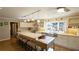 Spacious kitchen features an island with seating, modern appliances, and abundant natural light at 1104 Fox Ln, Woodstock, GA 30188