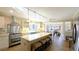 Open-concept kitchen with stainless steel appliances, a large island with seating, and ample counter space at 1104 Fox Ln, Woodstock, GA 30188