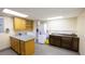 Well-lit laundry room featuring a washer, dryer, sink and ample storage at 1104 Fox Ln, Woodstock, GA 30188