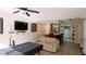 Entertaining living room featuring a bar, large tv and a view of the kitchen at 1104 Fox Ln, Woodstock, GA 30188